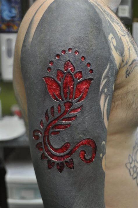 scarification over black tattoo|More.